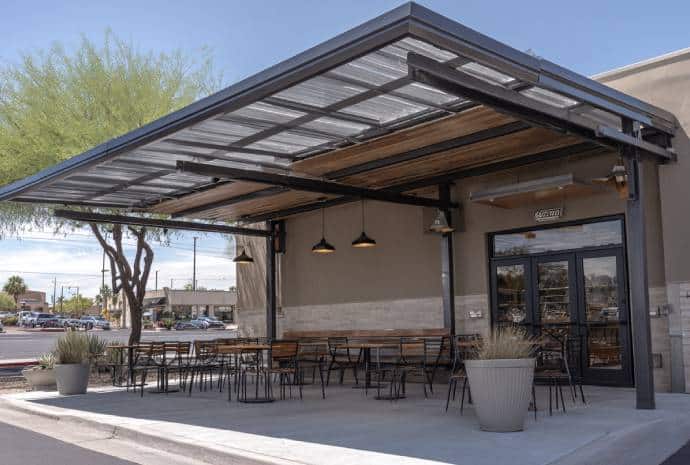 Covered outdoor seating area with tables