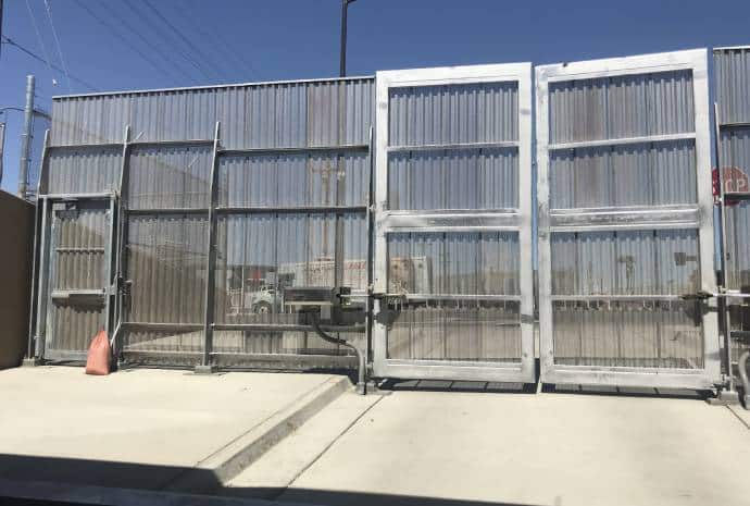 Automated metal gate in sunlight.