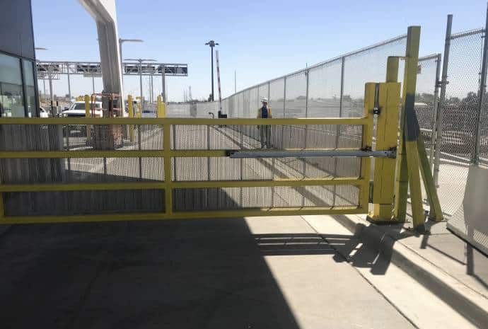 Yellow security gate in open position