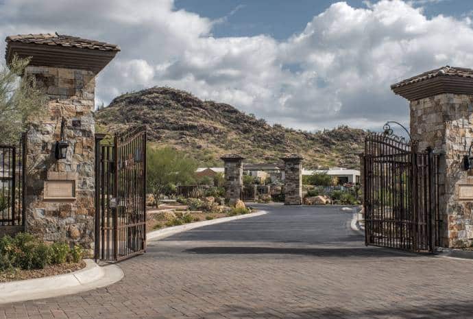 Open gates leading to a hillside.
