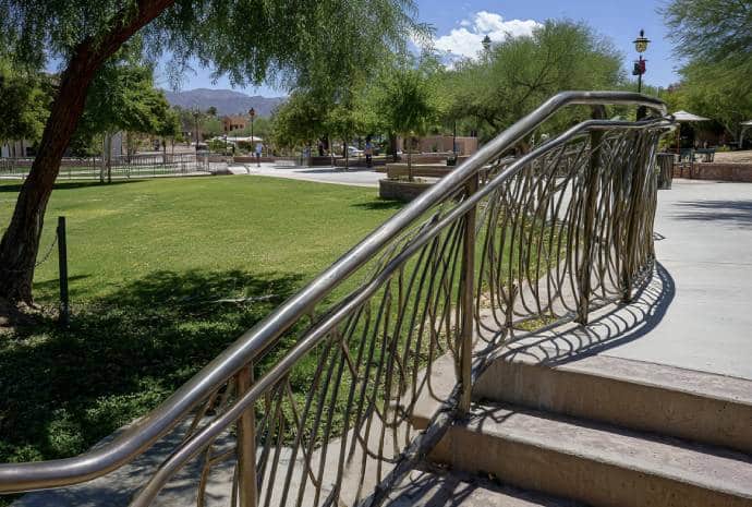 Curved metal handrail in park