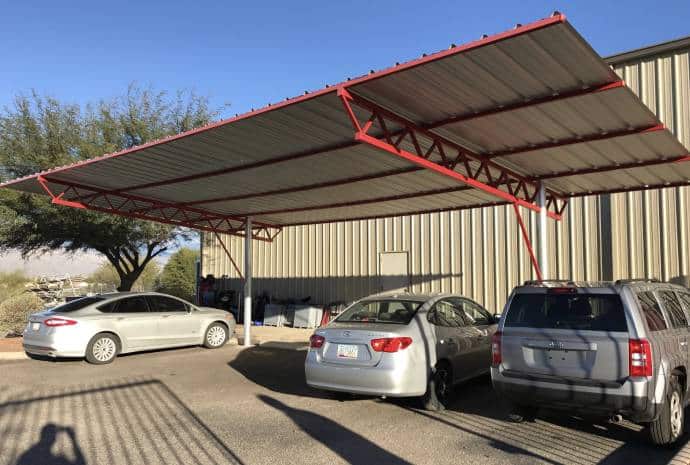 Carport sheltering parked vehicles
