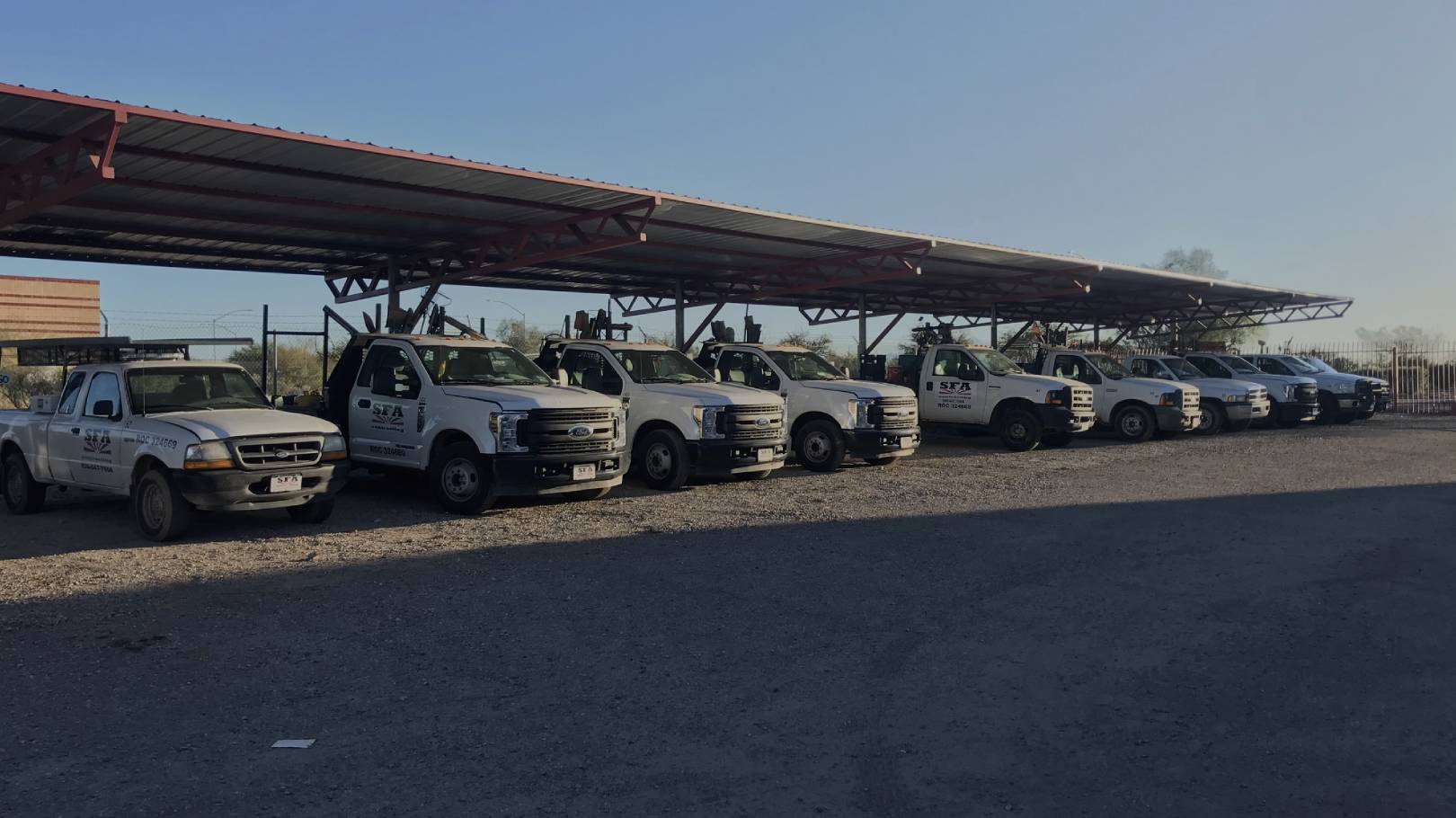 Row of trucks under solar panels